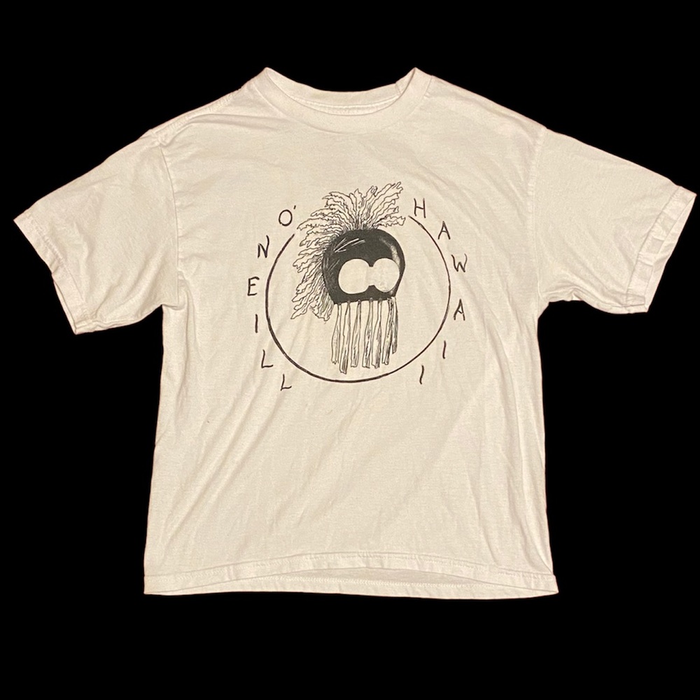 Woman’s white tee with printed black O’Neill graphic and logo.